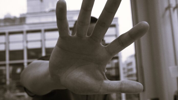 man-holding-out-his-hand